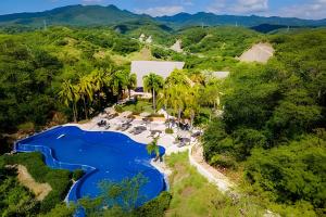 an aerial view of the pool at the resort at Alamar Vallarta vta in Cruz de Huanacaxtle