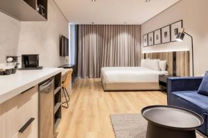 Voodi või voodid majutusasutuse Vuestro Hotel Boutique toas