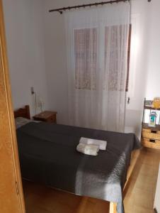 Postel nebo postele na pokoji v ubytování DORA'S HOUSE Douneika