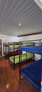 Llit o llits en una habitació de SelfStay Inn Faaa
