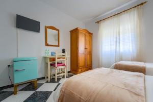 Postel nebo postele na pokoji v ubytování Hostal del Faro