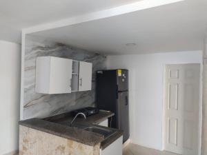 Kuchyň nebo kuchyňský kout v ubytování Bahía Caribe