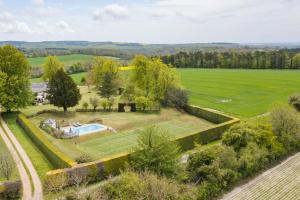 an aerial view of a garden with a swimming pool at Telegraph House by inspirestays-com in Chichester