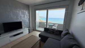 A television and/or entertainment centre at Apartments Paradise Lloret