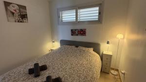 A bed or beds in a room at Apartments Paradise Lloret