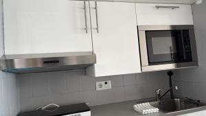 A kitchen or kitchenette at Apartments Paradise Lloret