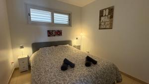 A bed or beds in a room at Apartments Paradise Lloret