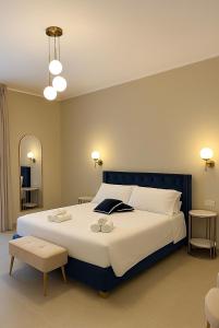 Postel nebo postele na pokoji v ubytování Maison ì room & suites