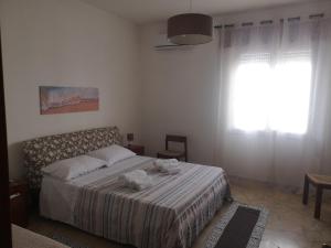 Postel nebo postele na pokoji v ubytování Casa Cortileverde