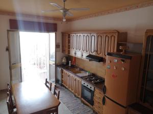 Kuchyň nebo kuchyňský kout v ubytování Casa Cortileverde