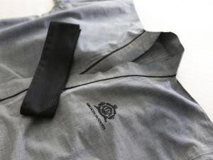 a black tie sitting on top of a gray shirt at APA Hotel Akihabara Ekimae in Tokyo