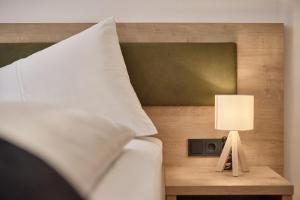 Postel nebo postele na pokoji v ubytování Das Refugium Mountain Apartment Ötztal - Längenfeld