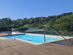 a large swimming pool with blue water on top of a building at Zimbali Lakes Boulevard Suites 145 in Ballito