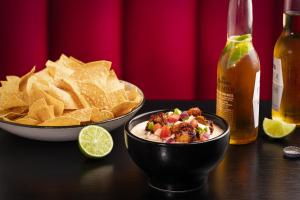 a table with a bowl of chips and a bowl of food at Harrah's Gulf Coast Hotel & Casino in Biloxi