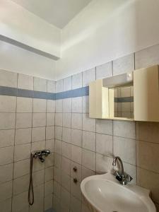 a bathroom with a sink and a mirror at Physis Seaside Living in Preveza +52 photos