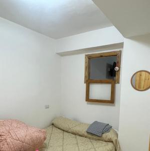 a bedroom with a bed and a mirror at Casa Tommaso in Camigliatello Silano