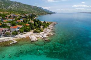 an aerial view of a small island in the water at Apartments Bono in Karlobag
