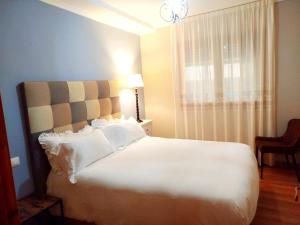 A bed or beds in a room at L'arome de Ainsa