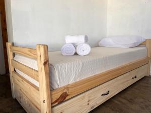 a bed with two towels on top of it at Quinta los Lopez in Azul +56 photos
