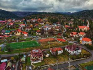 an aerial view of a town with a soccer field at Casa Forrás in Borsec