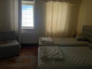 Ein Bett oder Betten in einem Zimmer der Unterkunft Daisy