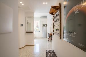 a hallway of a building with a sign on the wall at Central Cernobbio - Modern apartment in Cernobbio