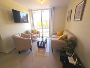 a living room with two couches and a tv at Apartamento Premium frente a Universidad San Marcos para 4 pers en lima in Lima