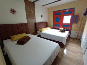 Postel nebo postele na pokoji v ubytování Casa Naranja Salento 2