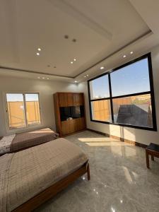 Ένα ή περισσότερα κρεβάτια σε δωμάτιο στο aloha chalet