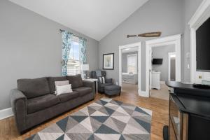 a living room with a couch and a table at The Rushes - 47 Butternut in Cherry Valley +88 photos