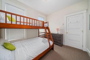 a bedroom with a bunk bed with a ladder at The Cattail - 26 Meadowview in Cherry Valley