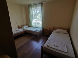 a room with two beds and a window at ELIT Holiday Village in Obzor
