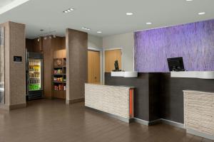 a lobby with a counter and a refrigerator at Fairfield Inn & Suites by Marriott Moscow in Moscow