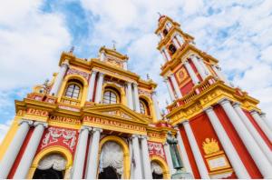 a large building with a clock tower on top of it at Altos del Norte - Salta la Linda ! in Salta