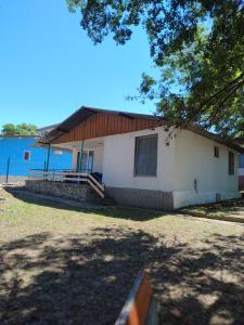 a white house with a brown roof at ELIT Holiday Village in Obzor