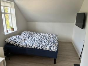 Postel nebo postele na pokoji v ubytování Bondelejlighed