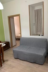 a bed sitting in a room with a mirror at Orologio21-Soggiorna al teatro Massimo in Palermo +11 photos