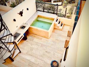 an overhead view of a swimming pool on a building at Casa Vibe Tulum Penthouse, Private Pool & Terrace in Tulum