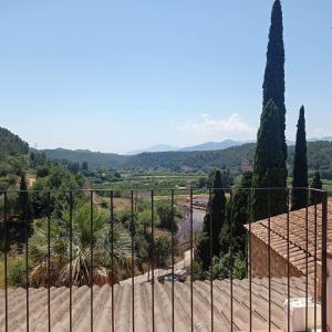 a view from the top of a building through a fence at Casa Ermita in Benifallet