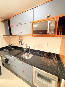 Una cocina o zona de cocina en Exclusivity in Itajaí Port with Wi-Fi and Jacuzzi