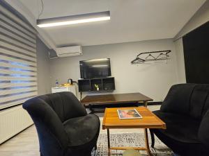 Posezení v ubytování JirHouse Sarıköşk Suit + 10 fotografií