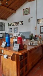 a kitchen with a wooden counter top with a counter top at The Black Sheep Inn in Huamboya