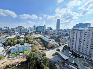 an aerial view of a city with tall buildings at Stunning City View Apartment Sandton City-The Capital On The Park in Johannesburg