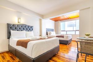 Letto o letti in una camera di Hotel Cusco Guest Home