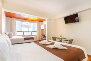 Letto o letti in una camera di Hotel Cusco Guest Home
