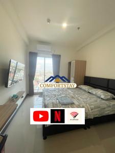 Ένα ή περισσότερα κρεβάτια σε δωμάτιο στο COMFORTSTAY - Citra Plaza Nagoya #10-25 City View