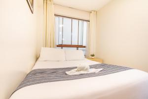 Letto o letti in una camera di Hotel Cusco Guest Home