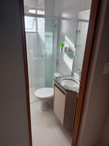 a bathroom with a toilet and a sink and a shower at Belíssimo Apto a 2 km da Litorânea in São Luís +31 photos