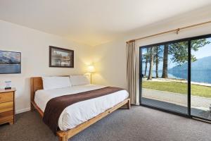 a bedroom with a bed and a large window at 145 Bldg C condo in Truckee