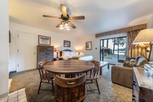 a living room with a dining room table and a bedroom at 144 Bldg C condo in Truckee
